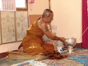 preparing the prayer water for spraying on the looksit